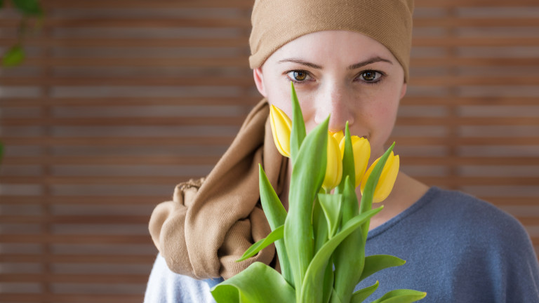 Young cancer patient with daffodils