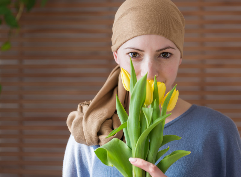 Young cancer patient with daffodils